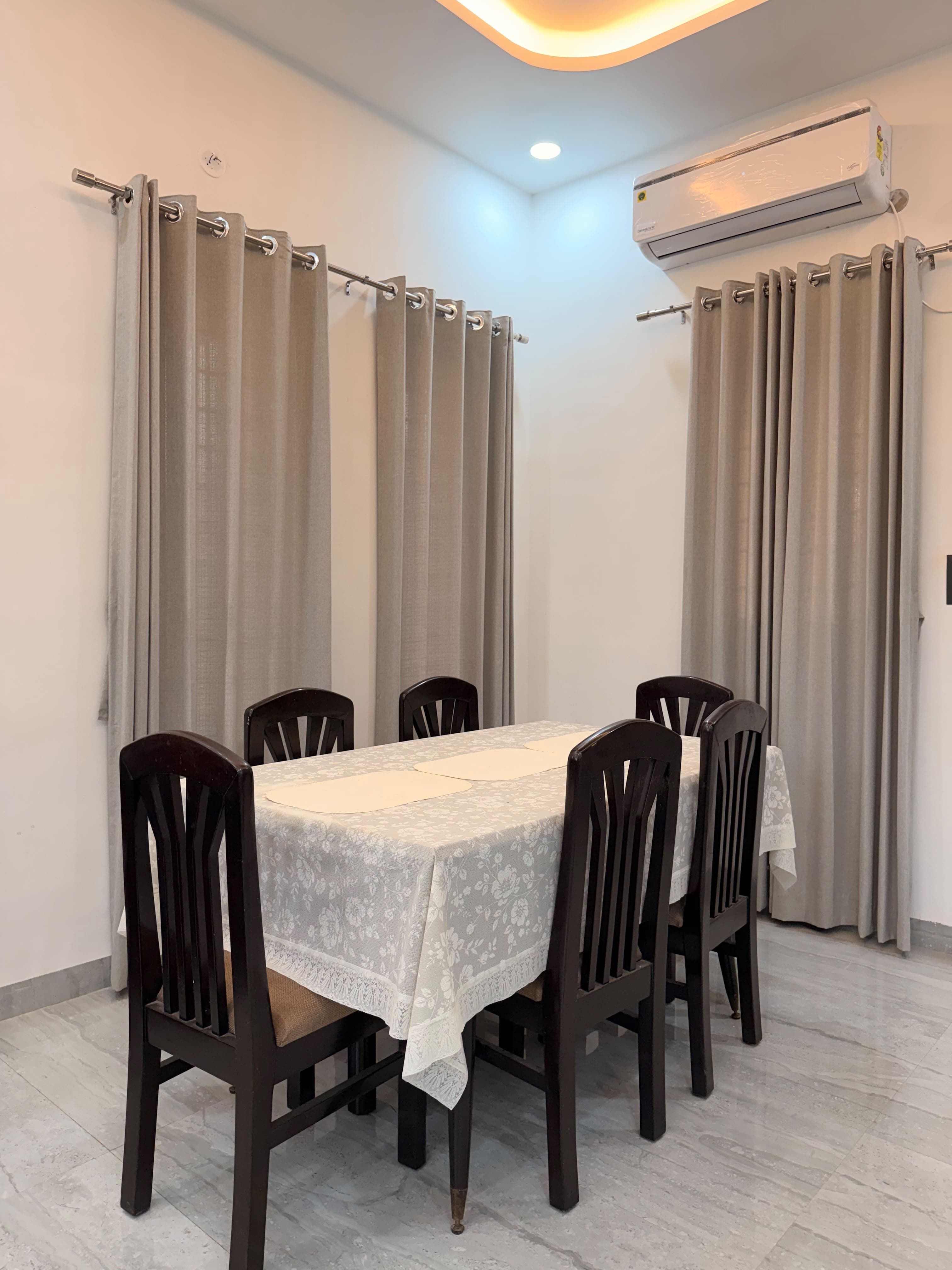 A dining table laid for a shared meal at Saanjh.