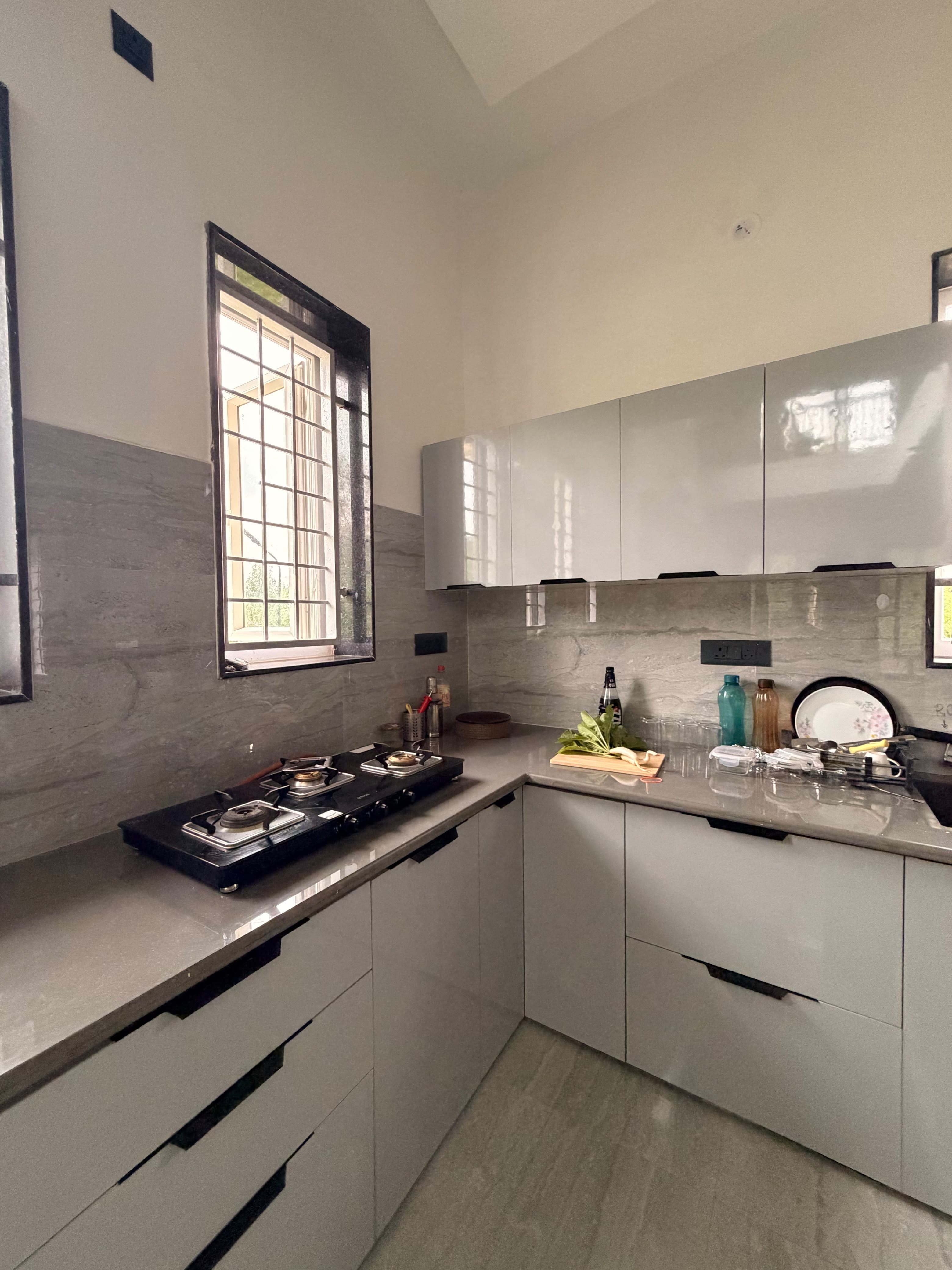 The equipped kitchen at Saanjh, with greens on the counter.